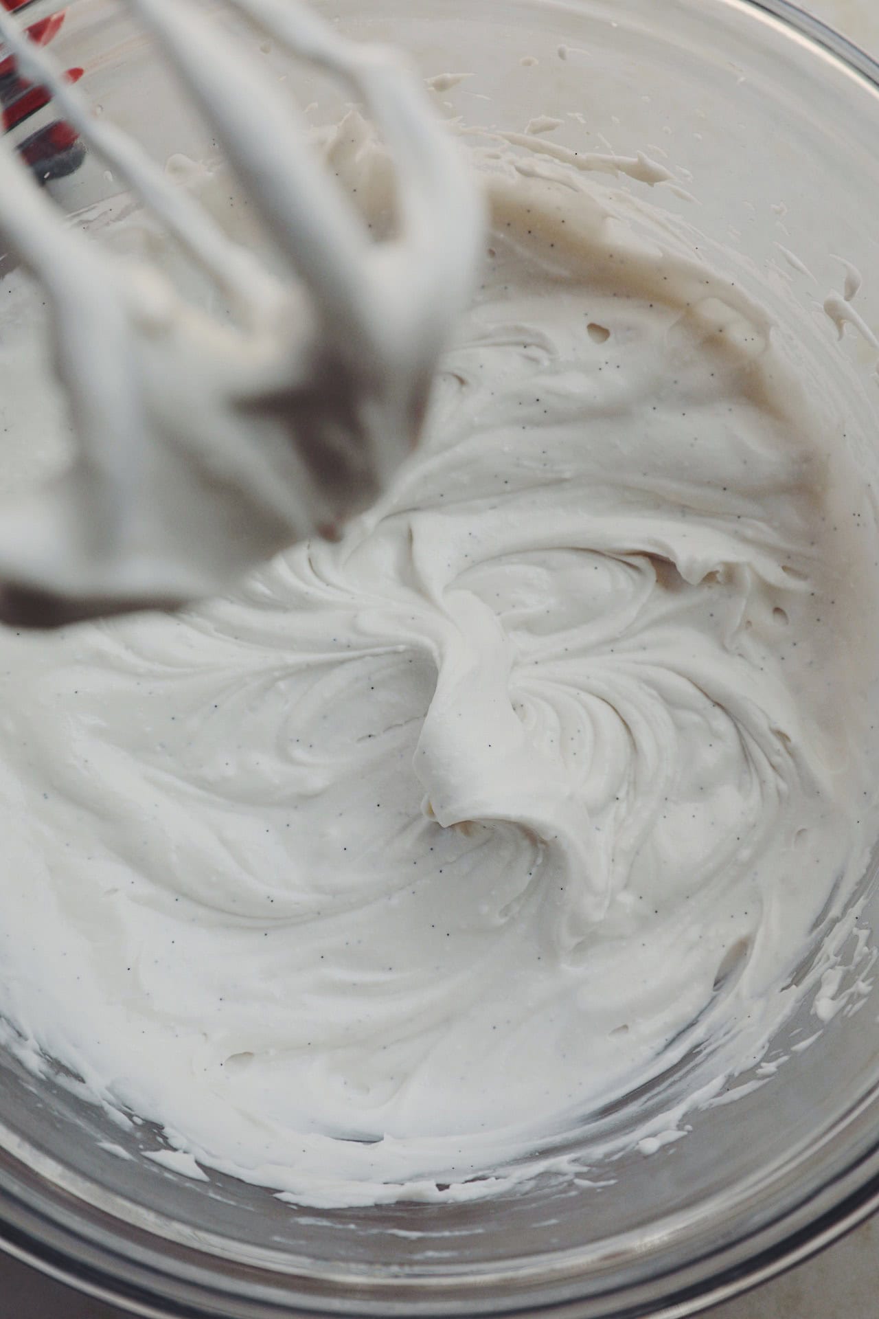 overhead of a glass bowl with coconut whipping cream in it
