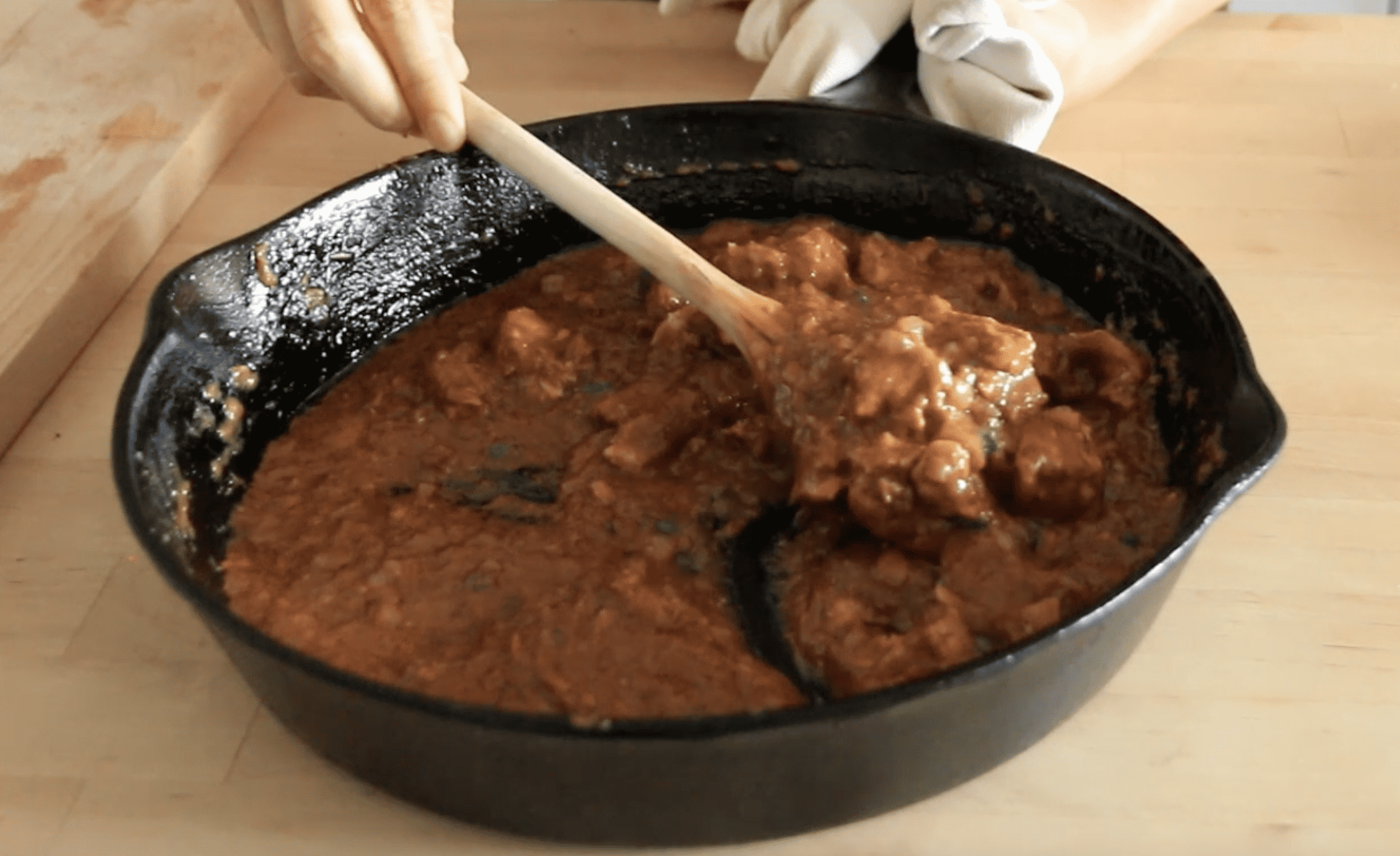 pan with a spoon serving vegan butter chicken