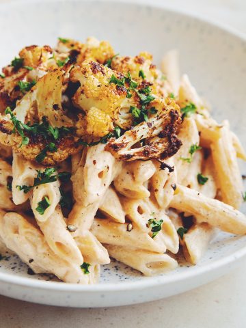 diners view of cauliflower alfredo sauce pasta