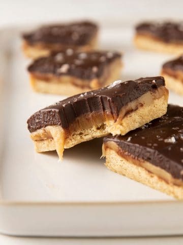 slices of vegan millionaire shortbread on a platter