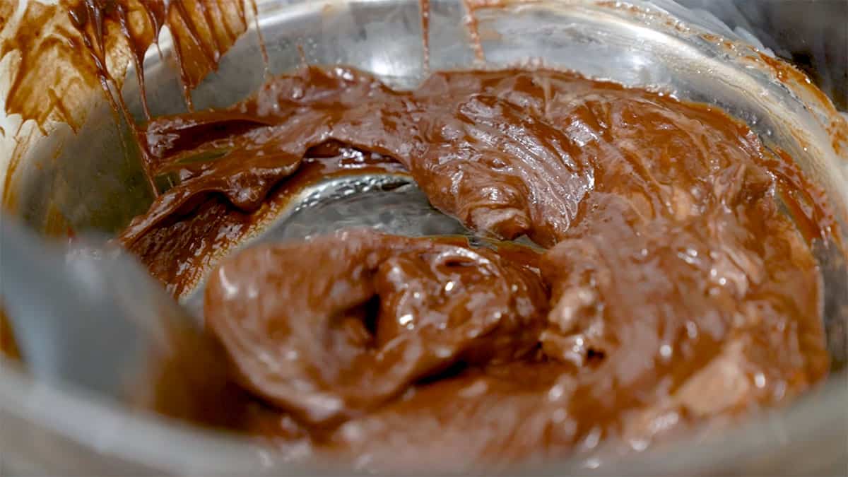 a bowl mixing melted chocolate 