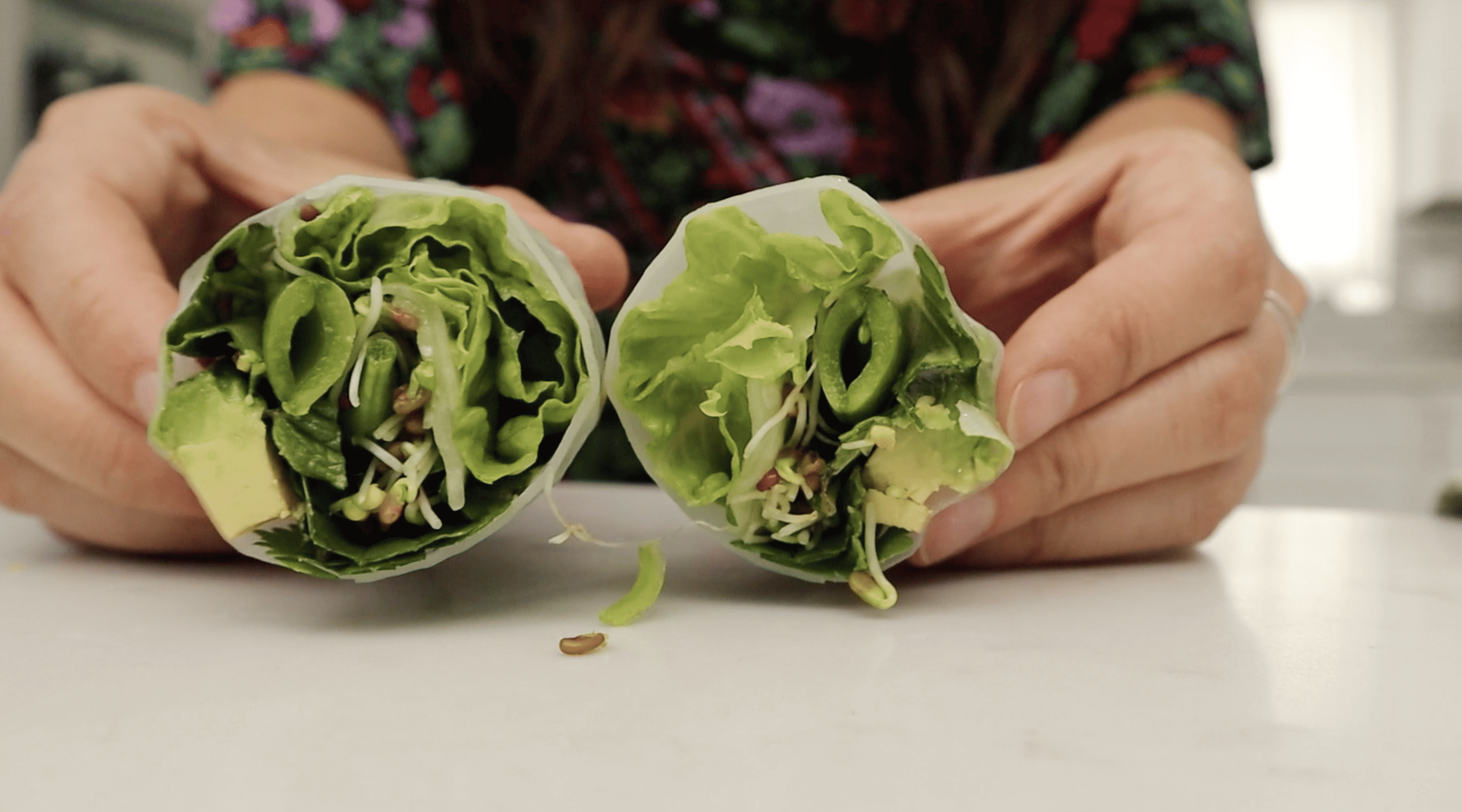 hands showing the inside of vegan summer roll