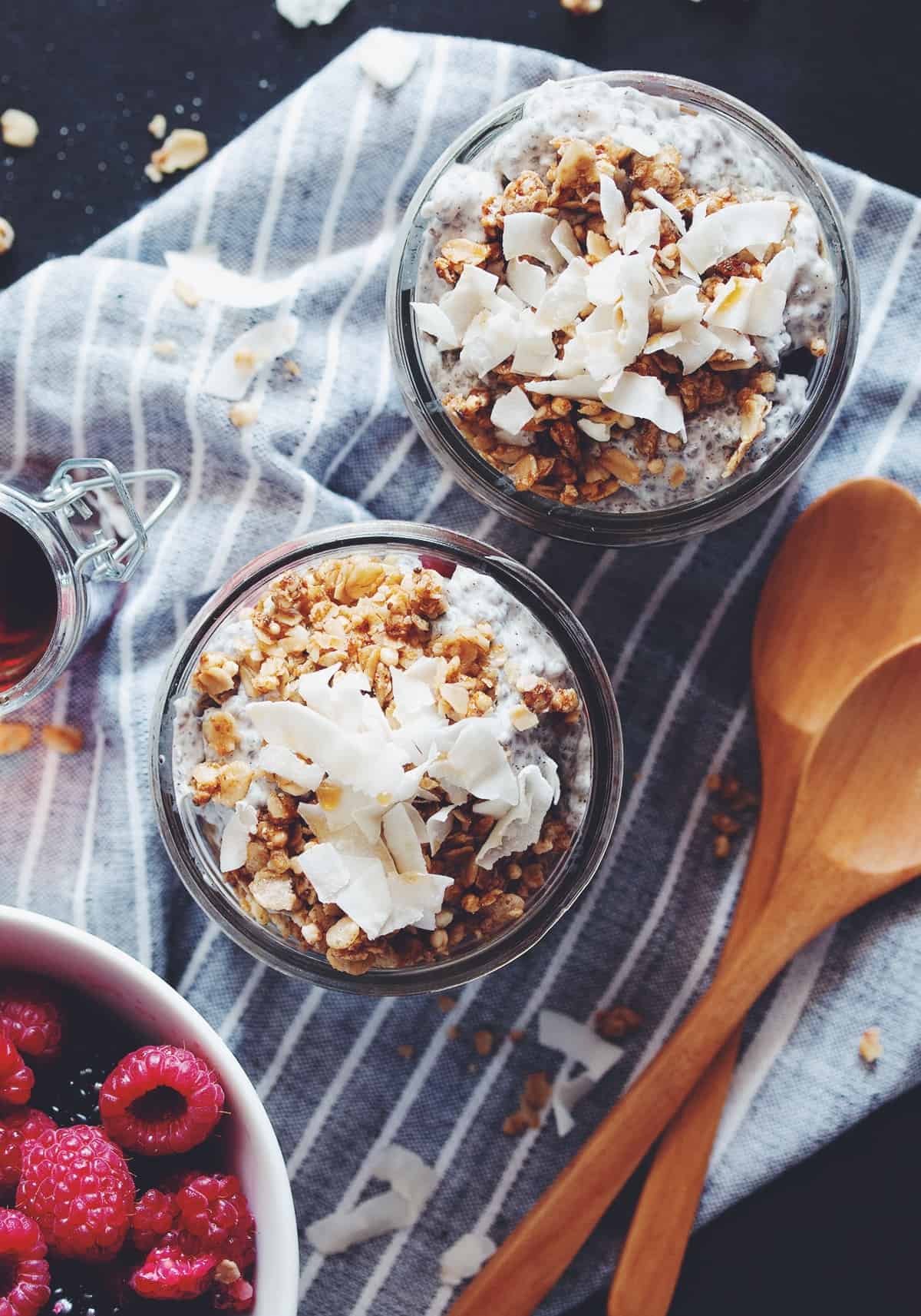 overhead of two jars of coconut milk and chia seed pudding parfaits
