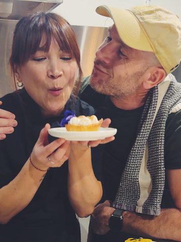 chef Lauren Toyota at her Toronto event holding a lemon meringue tart